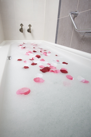 Bath water with rose petalsの写真素材