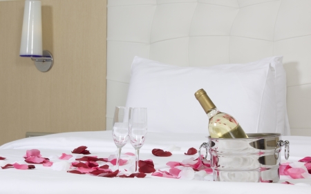 wine in bed to celebrate Valentine's Day at hotel roomの写真素材