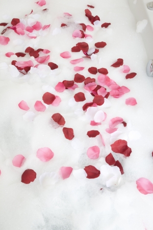Bath water with rose petalsの写真素材