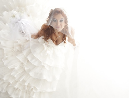 beautiful smiling bride on white backgroundの写真素材