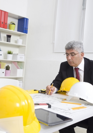 Portrait Of Architect With Blueprint In The Officeの写真素材