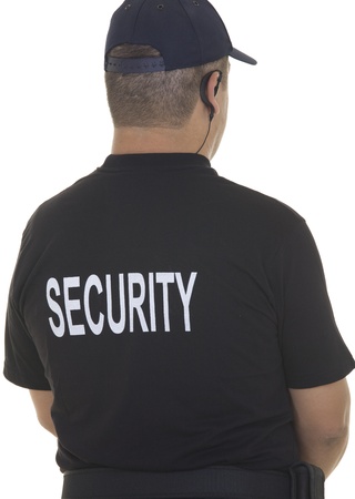 back of a security guard isolated on whiteの写真素材