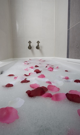 Bath water with rose petalsの写真素材