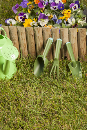 Garden tools on grass in yardの写真素材