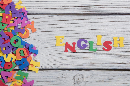 colorful words on white wooden background