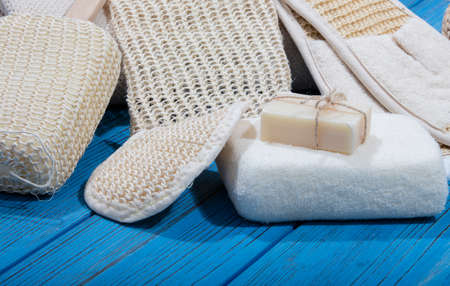 bath and spa accessories on blue wooden backgroundの写真素材