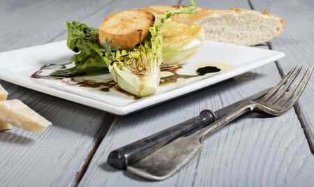 healthy green wedge salad and cheese and breadの写真素材