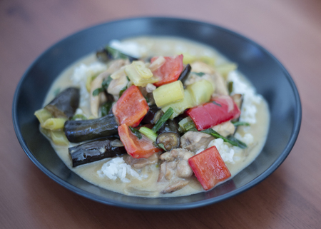 thai green chicken curry on black plateの写真素材