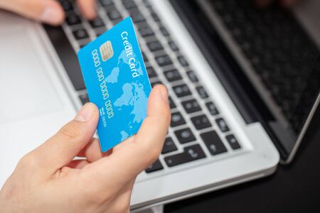 technology, shopping, banking, home and lifestyle concept - close up of man with laptop computer and...