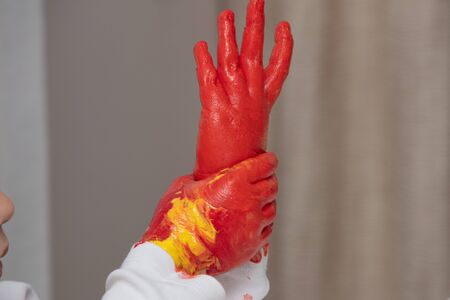 Child Finger Painting at home  On Paper at covid time . stay at homeの写真素材