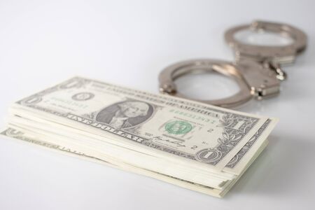 Handcuff above usa dollar. Theft, background