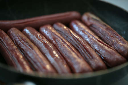 Close-up view of fried sausages. Meat fish. Cooking food. High quality photoの写真素材