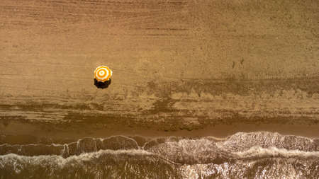 Top view of beach with umbrella. Golden sands, Izmir, Turkey. High quality photo