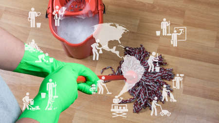 Young housekeeper cleaning floor mobbing holding mop and plastic bucket with brushes, . High quality...