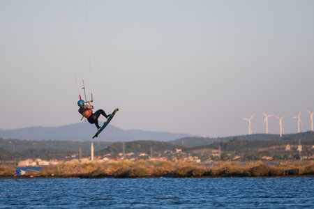 Gulbahce,Urla,Izmir,Turkey - July 30, 2023, People kite surf at the beach on a sunny afternoon in...
