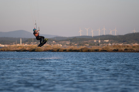 Gulbahce,Urla,Izmir,Turkey - July 30, 2023, People kite surf at the beach on a sunny afternoon in...