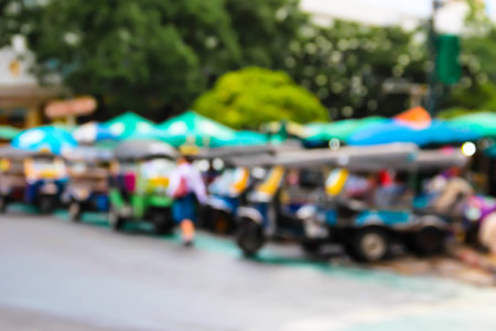 Abstract blur Tuktuk car taxi at the carpark in bangkok, thailand.の写真素材