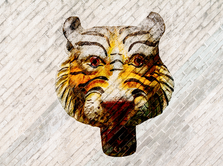 Tiger face on brick wall background.の写真素材