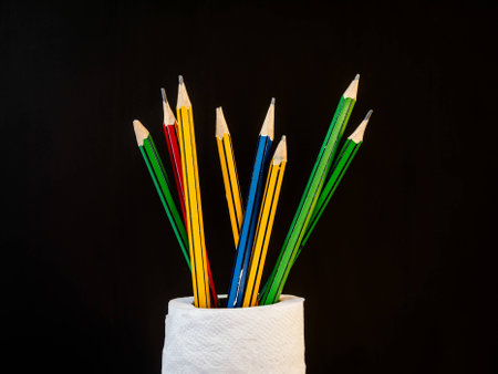 Pencil slot decoration in the tissue roll to use on back background.の写真素材