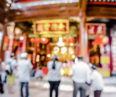 abstract blurred buddhist praying buddha in chinese temple,Thailandの写真素材