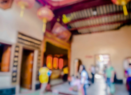 abstract blurred buddhist praying buddha in chinese temple,Thailandの写真素材