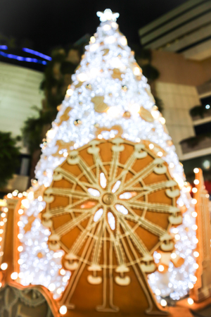 Abstract blurred christmas decorations outside at night. Photo vintage style.の写真素材