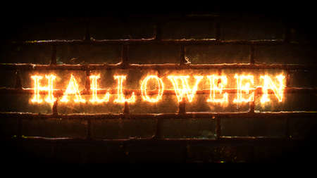 Fiery Happy Halloween inscription with brick wall on background. 3D render.の写真素材