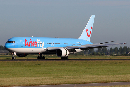 AMSTERDAM - JULY 02: ArkeFly (TUI Airlines Nederland) Boeing 767-383/ER lands at AMS Airport in Netherlands on July 02, 2012. ArkeFly is a Dutch charter airline Main base is Amsterdam Schiphol Airportのeditorial素材
