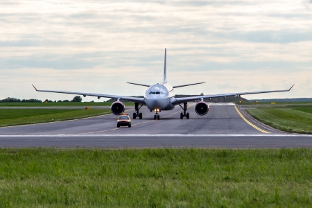 Aircraft taxiing for follow me carの写真素材