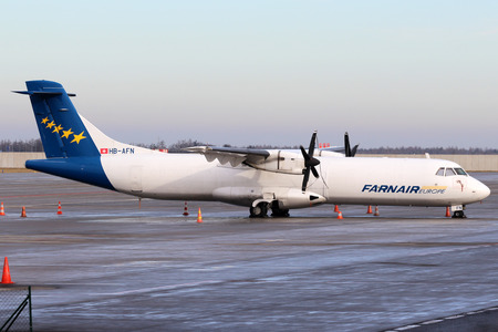 PRAGUE, CZECH REPUBLIC - JANUARY 03: ATR-72-201(F) Farnair Europe stands at PRG Airport on January 03, 2014. Farnair Europe operates regular express parcel services to the main hubs in Europe.のeditorial素材