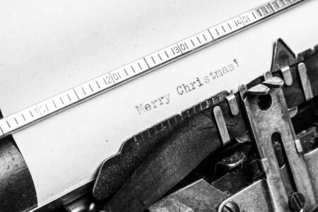 Inscription Merry Christmas! written on an old typewriter