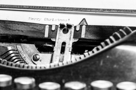 Inscription Merry Christmas! written on an old typewriter