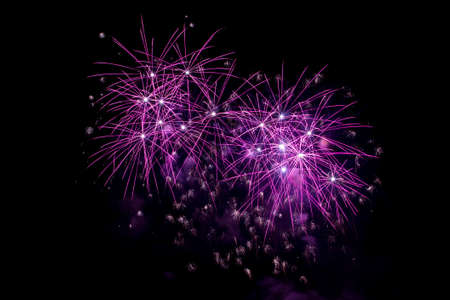 New Year celebrations - Colorful fireworks on the black backgroundの写真素材