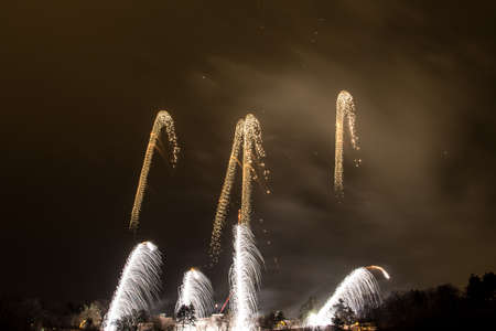 New Year celebrations - Colorful fireworks on the black backgroundの写真素材