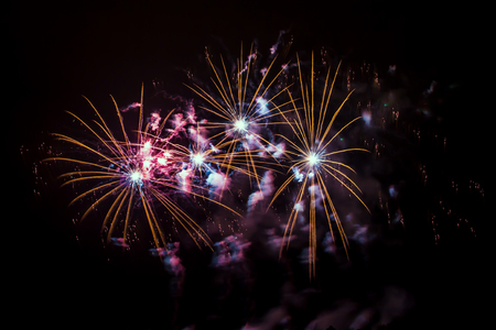 New Year celebrations - Colorful fireworks on the black backgroundの写真素材