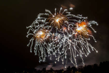 New Year celebrations - Colorful fireworks on the black backgroundの写真素材