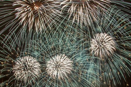 New Year celebrations - Colorful fireworks on the black backgroundの写真素材