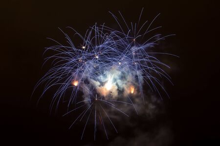 New Year celebrations - Colorful fireworks on the black backgroundの写真素材