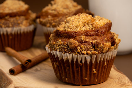 Homemade pumpkin muffins on a wooden board. Selective focus.の写真素材
