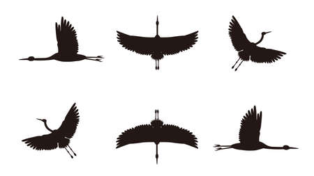 It is an illustration of a Crane flying silhouette set.のイラスト素材