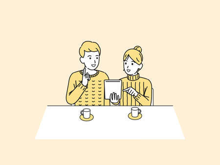 It is an illustration of a Couple using tablet.のイラスト素材
