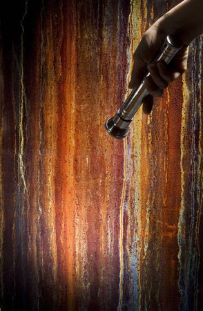 hand holding a flashlightの写真素材