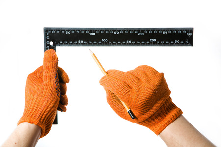 Steel Ruler in hand on white