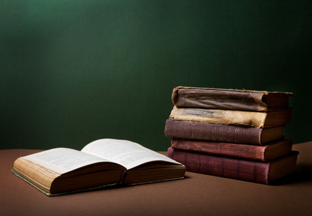 Open old book on tableの写真素材