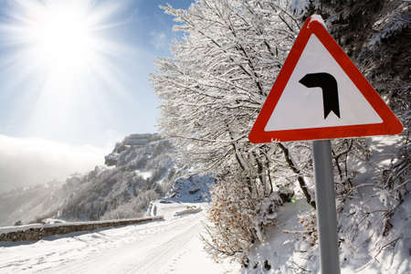 road sign on a mountain roadの写真素材
