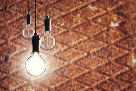 Idea and leadership concept - Vintage  bulbs on the grunge background