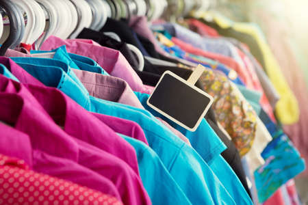 Clothes hanging on the rack in the fashion store
