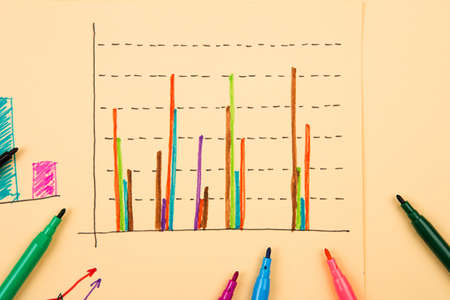 Business concept - Financial graphs drawn with colored pensの写真素材