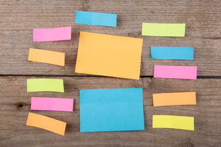 Colorful sticky notes on the wooden board