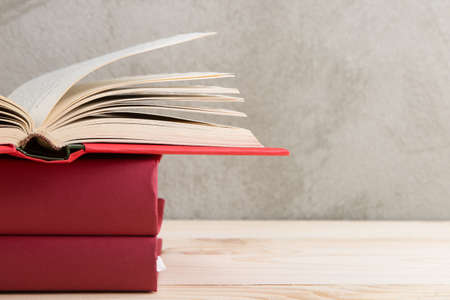 Education and reading concept - group of colorful books on the wooden tableの写真素材